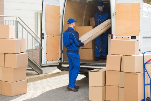 Moving team with boxes during a Norway removals job