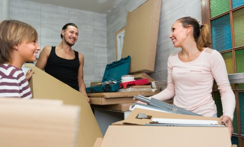 Removal team using protective packing and careful handling during a move
