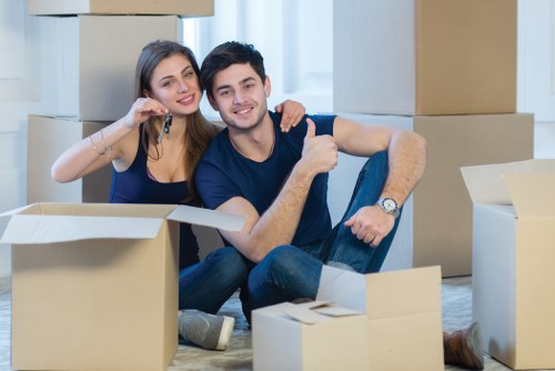 Moving team handling household removals in a Norwegian city apartment area