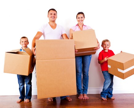Moving boxes and furniture being prepared for a home move in Norway