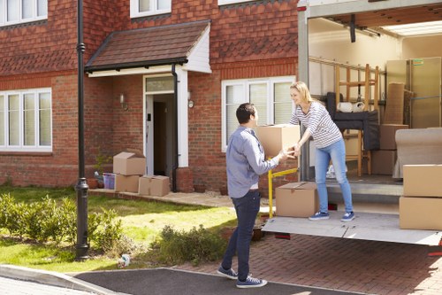 Packed moving boxes and furniture prepared for Norway removals