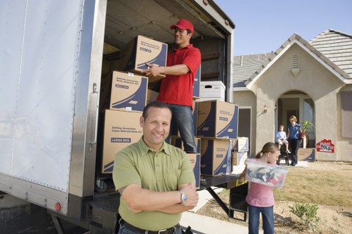 Removal vehicle loading household items for a relocation to Norway