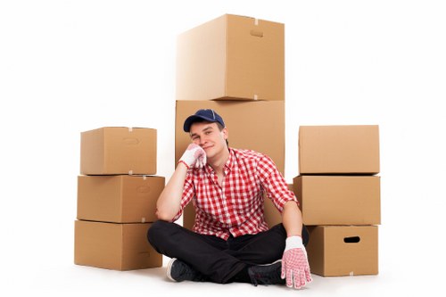 Trained removals staff handling furniture with safety awareness